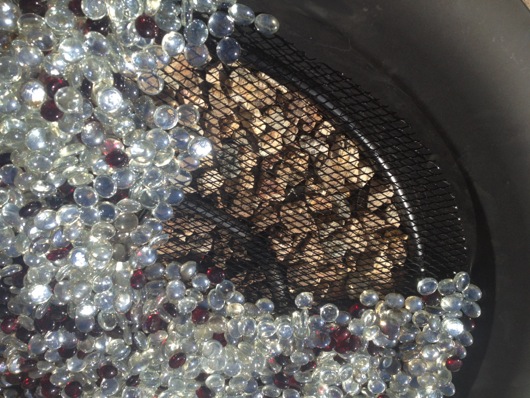 Beads on screen over ring and gravel