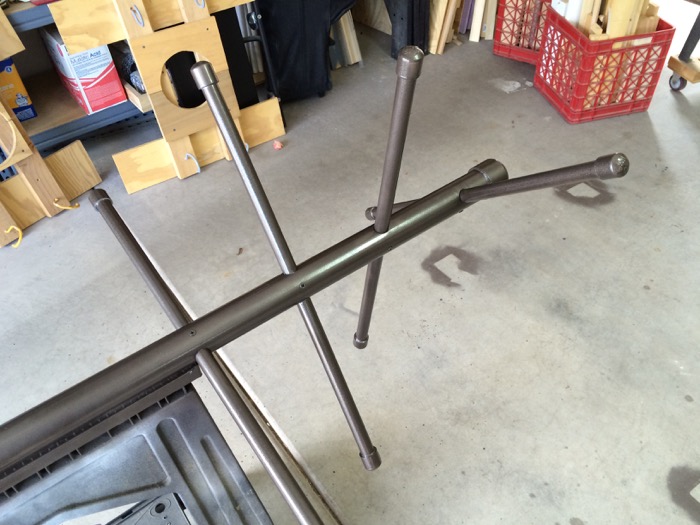 PVC towel tree laying on sawhorse, ready for painting