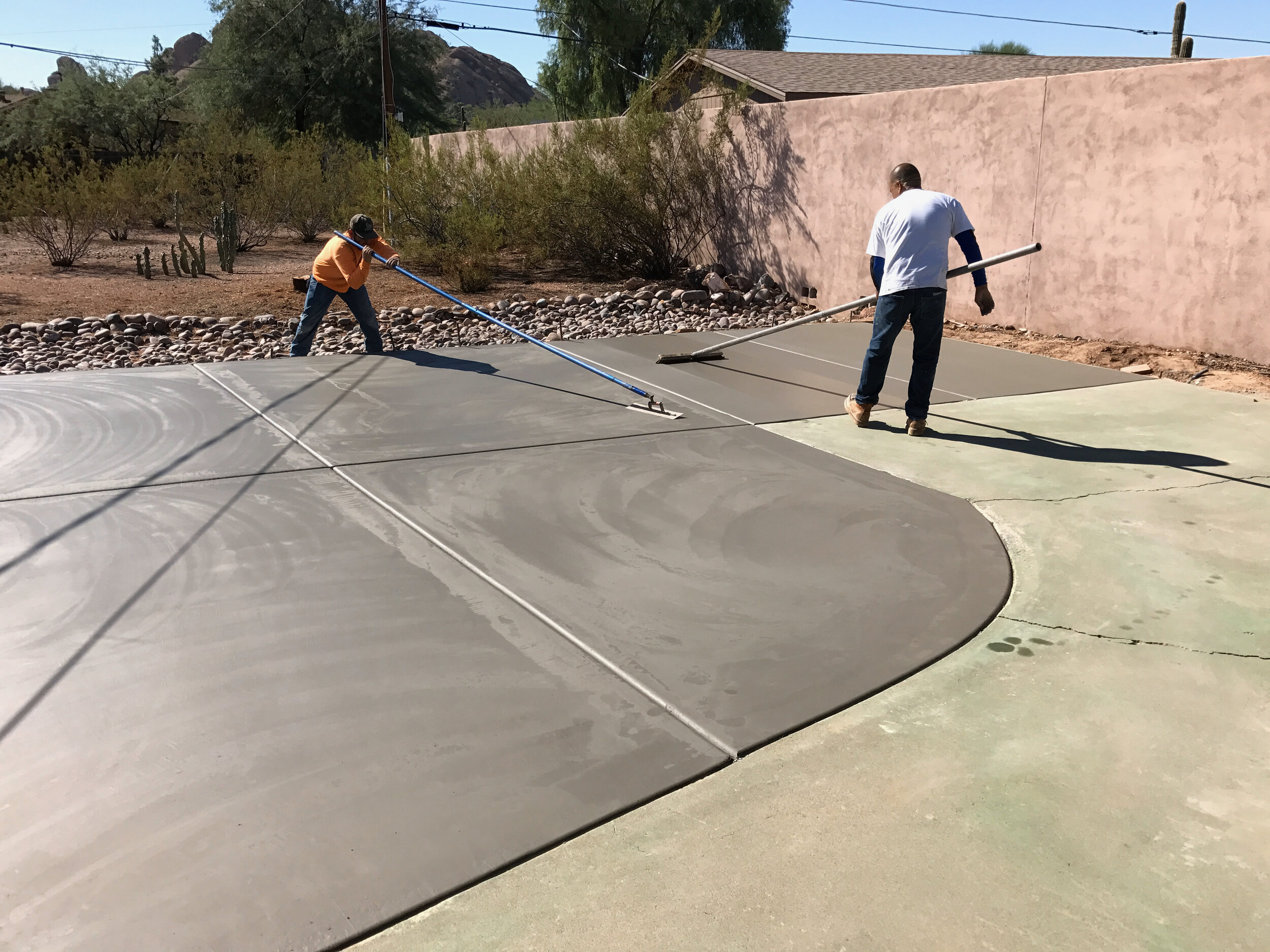 Smoothing out the concrete surface after it’s cured a little